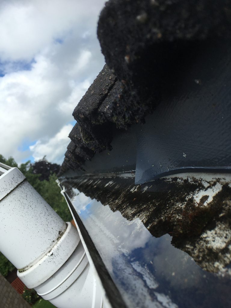 A blocked outlet is causing the gutters to overflow