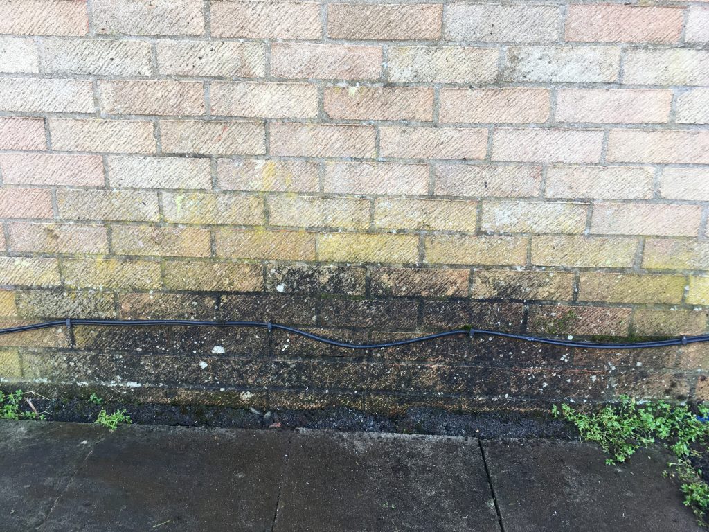 Damp patch caused by a leaking gutter